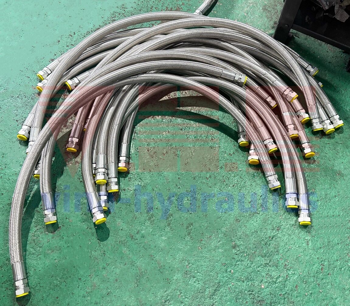 Hydraulic hose 1'' Alfagomma crimped with two straight BSP fittings and stainless steel braided cover.